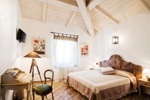 Postel nebo postele na pokoji v ubytování B & B I Ricordi