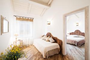 Postel nebo postele na pokoji v ubytování B & B I Ricordi