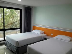 Ένα ή περισσότερα κρεβάτια σε δωμάτιο στο Sakura Budget Hotel
