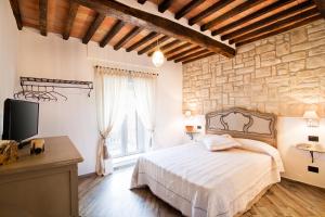 Postel nebo postele na pokoji v ubytování B & B I Ricordi