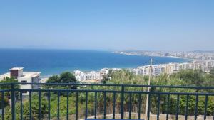 a view of the ocean from a balcony at Residenca Juli in Vlorë