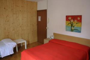 Ένα ή περισσότερα κρεβάτια σε δωμάτιο στο Albergo della Posta