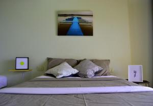 Postel nebo postele na pokoji v ubytování B&B Las Playitas