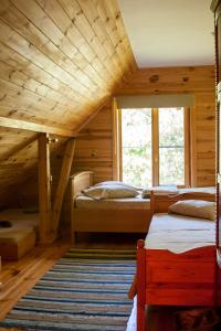 Llit o llits en una habitació de Guest House Pītagi
