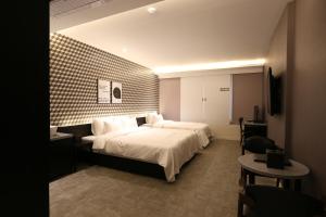 Postel nebo postele na pokoji v ubytování Le Idea Hotel Busan Station