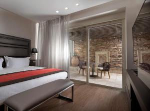 Postel nebo postele na pokoji v ubytování Holiday Suites