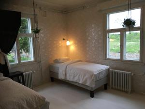 מיטה או מיטות בחדר ב-Guesthouse Kumpunen