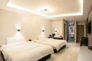Säng eller sängar i ett rum på Le Idea Hotel Busan Station