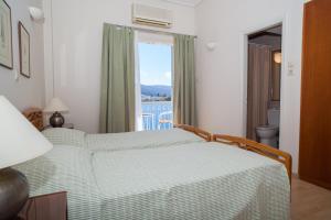 Postel nebo postele na pokoji v ubytování Hotel Saron