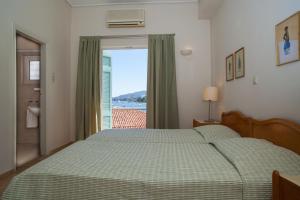 Postel nebo postele na pokoji v ubytování Hotel Saron