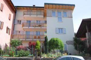 a building with balconies on the side of it at Ambiente 90 in Levico Terme