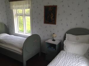 Säng eller sängar i ett rum på Storjord Hotel