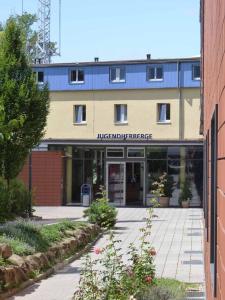 a large building with a sign that reads interpreter at Jugendherberge Heidelberg International in Heidelberg
