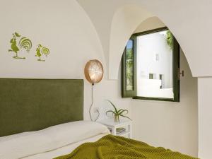 En eller flere senge i et værelse på Masseria Narducci