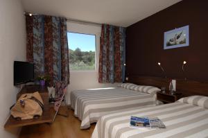 Postel nebo postele na pokoji v ubytování Hotel Le Lagon + 16 fotografií