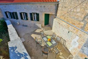an overhead view of a patio with a table and chairs at Vacation home Vibor in Dračevica