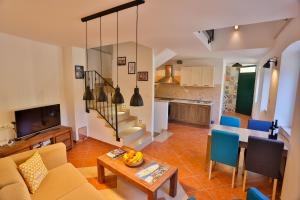 a living room with a couch and a table at Vacation home Vibor in Dračevica