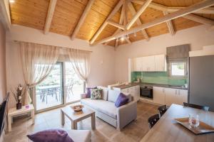 a living room with a couch and a table at Casa Sivota in Syvota