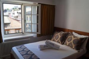 Posteľ alebo postele v izbe v ubytovaní Hotel Old Town