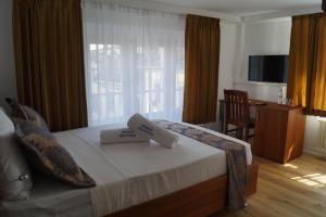 Posteľ alebo postele v izbe v ubytovaní Hotel Old Town