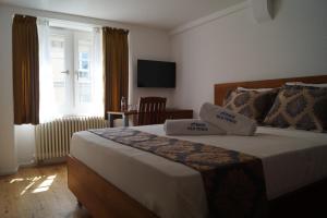 Posteľ alebo postele v izbe v ubytovaní Hotel Old Town
