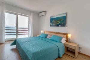 Postel nebo postele na pokoji v ubytování Apartment Marika