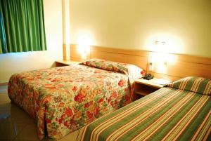 Postel nebo postele na pokoji v ubytování Hotel Domani
