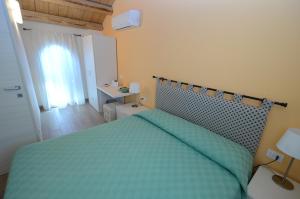 Ένα ή περισσότερα κρεβάτια σε δωμάτιο στο antiche distillerie "buon dormire"