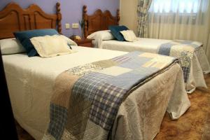 Postel nebo postele na pokoji v ubytování Hostal pachin