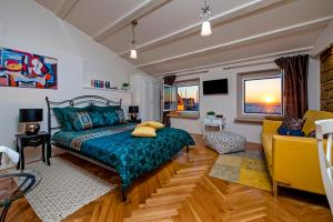a bedroom with a bed and a couch at Luxury Studio '936' in Rovinj