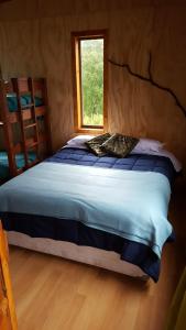Una cama o camas en una habitación de Rustico Pucon