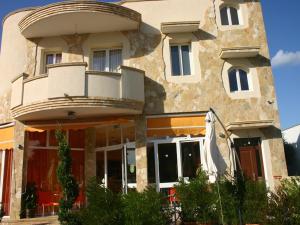 a large building with a porch and a balcony at B&B L'Angolo in Sannicola