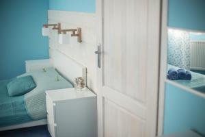 A bed or beds in a room at Villa Kokosowa