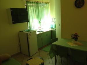 Kuchyň nebo kuchyňský kout v ubytování Apartments Pilić