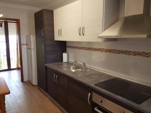 a kitchen with a sink and a counter top at Plaza Principal Zahara - MAGNIFICA UBICACION y VISTAS in Zahara de la Sierra