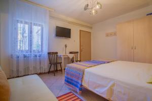 Postel nebo postele na pokoji v ubytování Rooms Ester