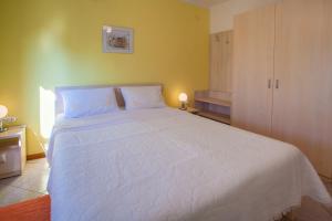 Postel nebo postele na pokoji v ubytování Rooms Ester