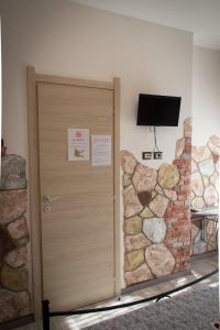 TV a/nebo společenská místnost v ubytování Rocca Pinta Guest House
