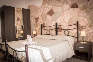 Postel nebo postele na pokoji v ubytování Rocca Pinta Guest House