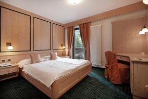 Postel nebo postele na pokoji v ubytování Beauty & Vital Hotel Maria