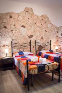 Postel nebo postele na pokoji v ubytování Rocca Pinta Guest House