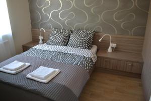 Posteľ alebo postele v izbe v ubytovaní Apartament New Gdynia