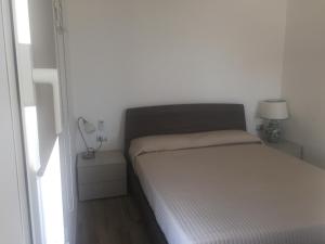 Postel nebo postele na pokoji v ubytování Un angolo di mare
