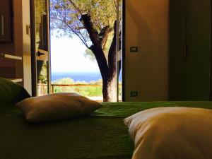Łóżko lub łóżka w pokoju w obiekcie Il Caprarizzo