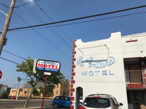 a sign on the side of a building with a motel at La Fontana Motel in Seaside Heights