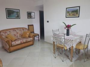 a living room with a couch and a table at Ilir Guest House 1 in Përmet