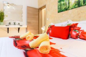 a bedroom with a bed with red pillows at Villa Lucija Bol in Bol +68 photos