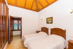Postel nebo postele na pokoji v ubytování Villa Corralejo Beach + 26 fotografií