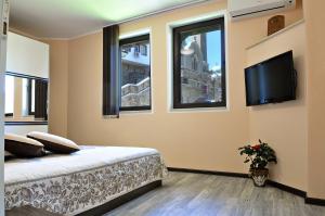 A bed or beds in a room at St George Apartment