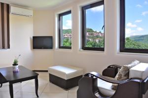A television and/or entertainment centre at St George Apartment